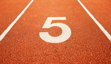Lane five starting point on running track.