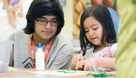 BGC's Fast Forward initiative regrouped clubs by type, such as large clubs in major cities, those that serve Native American lands, and those located in military instillations, to give them more customized support. Two children working on a project at a table